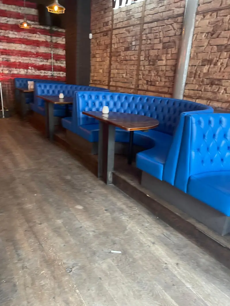 Blue buttoned booth seating, installed