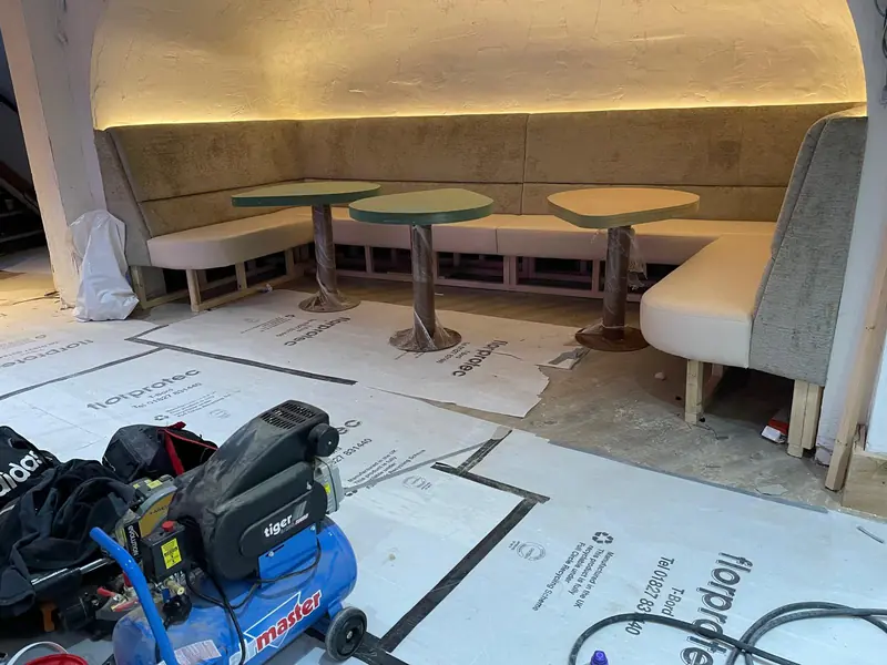 Booth run down a venue wall